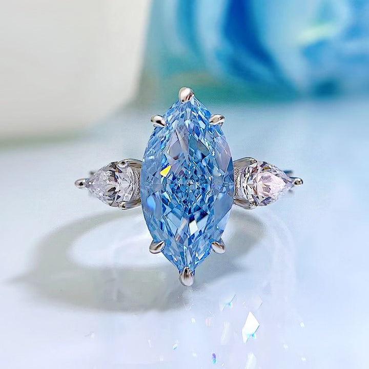 Ice Blue Promise · Marquise Solitaire & Pear Three-Stone Ring