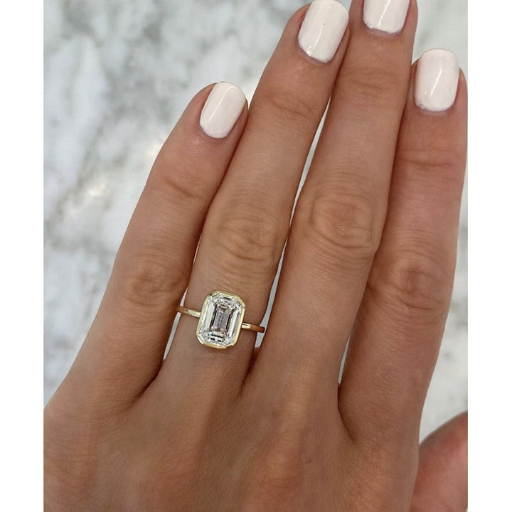 Minimalist Bezel 18K Gold Emerald-Cut Solitaire Ring