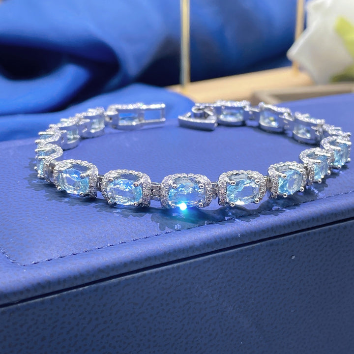 Ocean Blue Elegance 18K White Gold Aquamarine Halo Diamond Bracelet