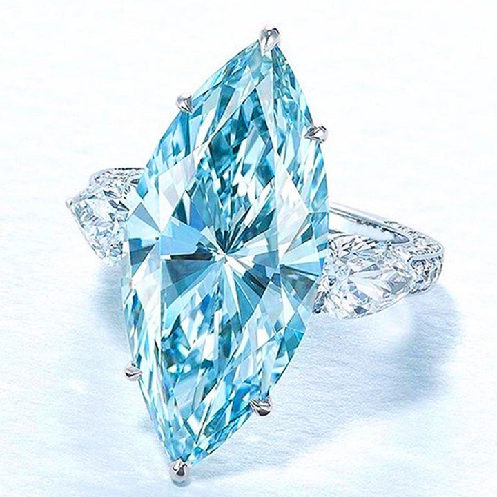 Ice Blue Promise · Marquise Solitaire & Pear Three-Stone Ring