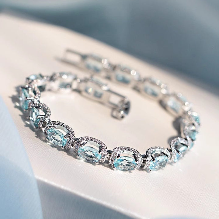 Ocean Blue Elegance 18K White Gold Aquamarine Halo Diamond Bracelet