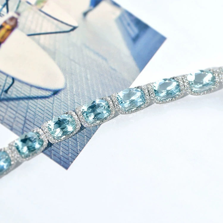 Ocean Blue Elegance 18K White Gold Aquamarine Halo Diamond Bracelet